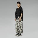 BLUSA CON SCOLLO A SCALETTA NERA