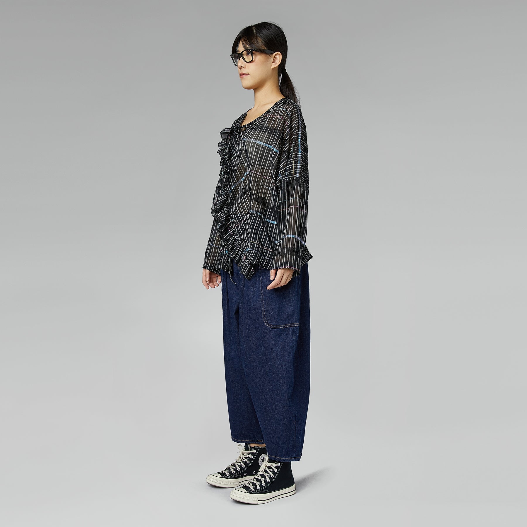 BLUSA SEMI-TRASPARENTE CON ROUCHE NERA