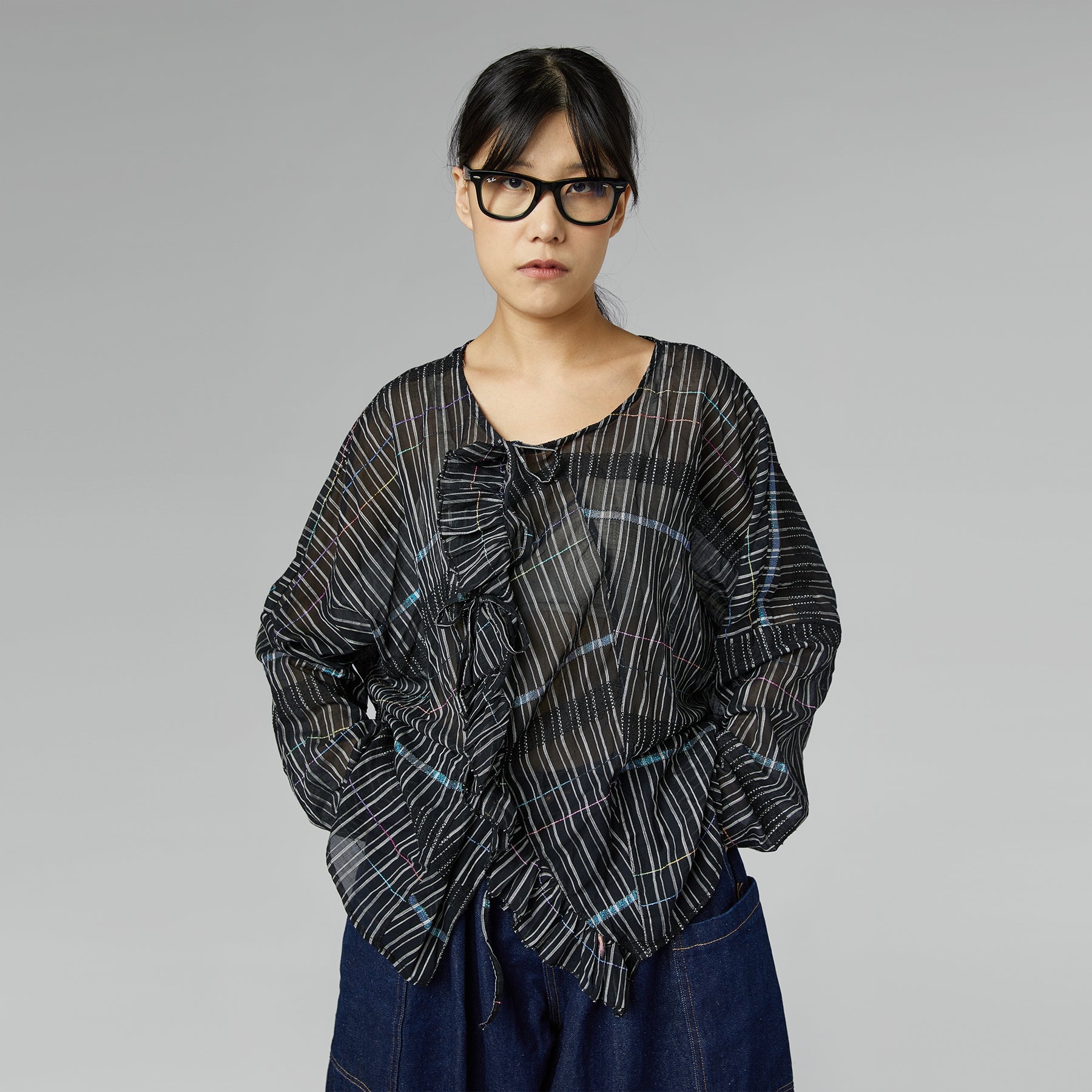 BLUSA SEMI-TRASPARENTE CON ROUCHE NERA