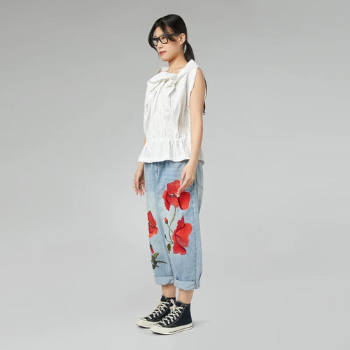 JEANS CON RICAMO DI PAPAVERI