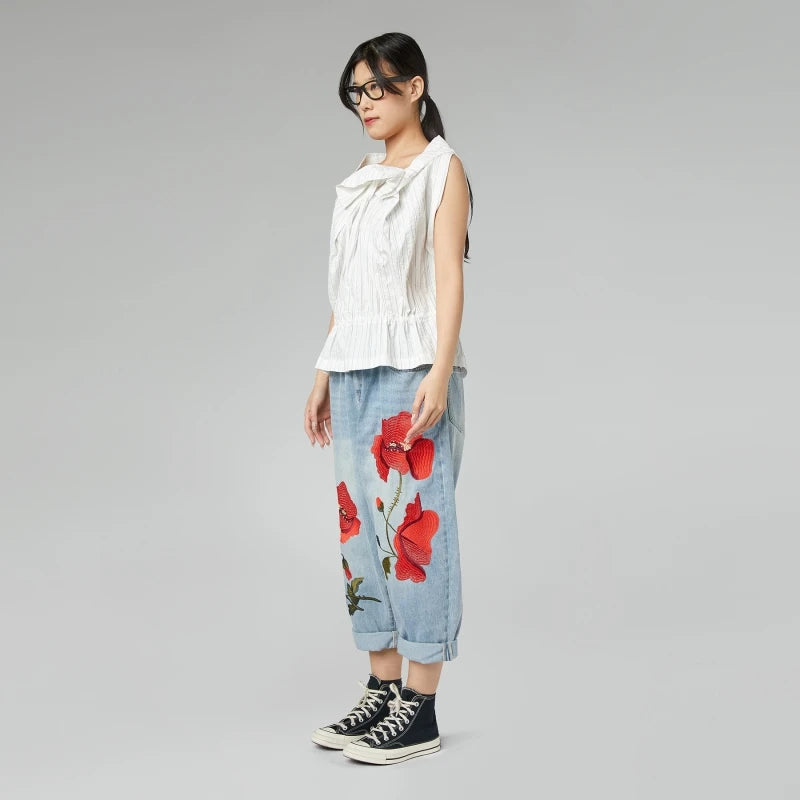 JEANS CON RICAMO DI PAPAVERI