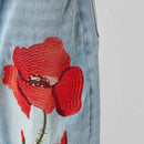 JEANS CON RICAMO DI PAPAVERI