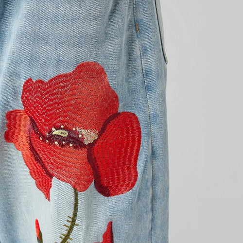 JEANS CON RICAMO DI PAPAVERI